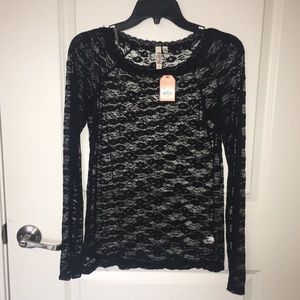 NWT. Black stretch lace long sleeve top.